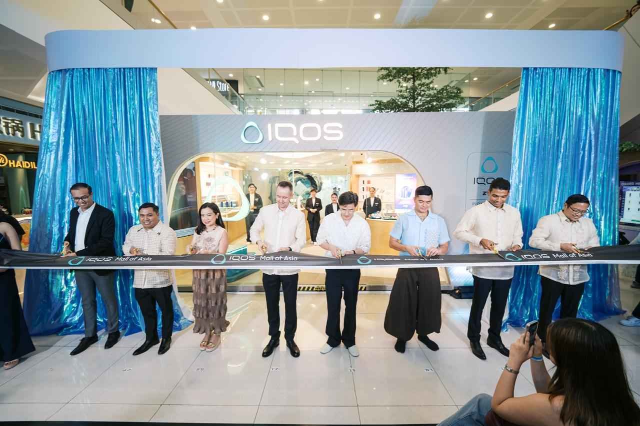 Attending the ribbon-cutting ceremony for the redesigned IQOS boutique at SM Mall of Asia on October 1, 2026 are (from left) Atty. Arnaldo Cariño, Senior Director, Government Relations; Crismer Tiria, Director, Smoke-Free Products Marketing and Digital; Gillian Gonzalez, Director, Channels; Zhenya Ivanov, PMFTC, Inc. President; Steven Tan, SM Supermalls President; Leeroy New, Artist and Designer; Vicknatheeban Tharmalingam, Senior Director, Smoke Free Products Philippines; and Atty. Ferdi Echiverri, Director, Communications.